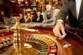 Live-dealer roulette studio showing multi-camera broadcast and player interface on mobile phone